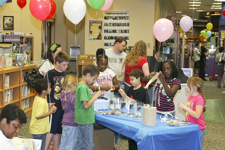 Children at an event with balloons