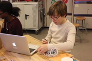 A student at the New York Hall of Science Learning Lab in Queens applies what he has learned about Arduino programming.