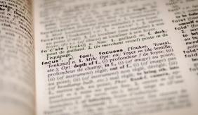 An image of a dictionary page with most of the page blurred out except for the definition for "focus"