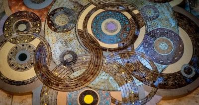 This artwork with concentric circles hangs in the lobby at National High Magnetic Field Laboratory and is crafted from the disks that make up the powerful magnets at the facility. Credit: Stephen Bilenky